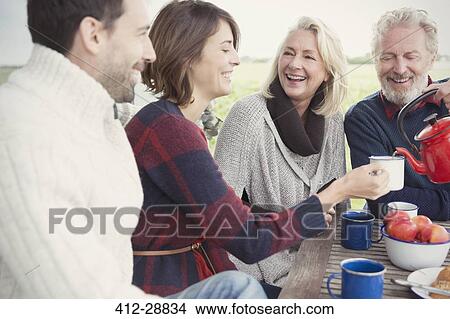 Couples drinking coffee on patio View Large Photo Image Picture - Couples drinking coffee on patio. Fotosearch