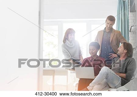 Creative business people using laptop in meeting View Large Photo Image Stock Image - Creative business people using laptop in meeting. Fotosearch