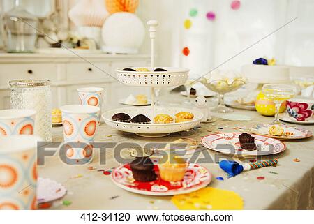 Cupcakes and decorations on birthday party table View Large Photo Image Stock Image - Cupcakes and decorations on birthday party table. Fotosearch