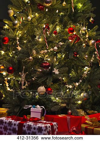 Stock Photograph - Decorated Christmas tree with lights. Fotosearch