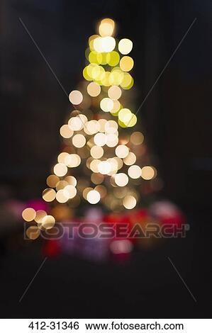 Stock Photograph - Defocused Christmas tree lights. Fotosearch
