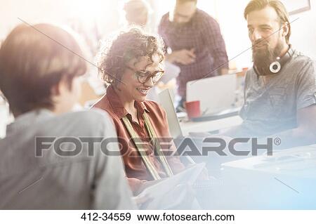 Design professionals meeting in office View Large Photo Image Stock Photo - Design professionals meeting in office. Fotosearch