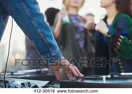 DJ spinning records at party View Large Photo Image Stock Photo - DJ spinning records at party. Fotosearch