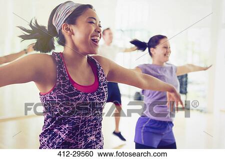 Enthusiastic women enjoying aerobics class View Large Photo Image Stock Image - Enthusiastic women enjoying aerobics class. Fotosearch