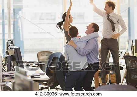 Exuberant business people celebrating and jumping in office View Large Photo Image Stock Photograph - Exuberant business people celebrating and jumping in office. Fotosearch