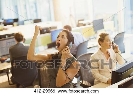 Exuberant woman on telephone celebrating good news in office View Large Photo Image Stock Photography - Exuberant woman on telephone celebrating good news in office. Fotosearch