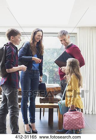 Family preparing to leave house in the morning View Large Photo Image Stock Photography - Family preparing to leave house in the morning. Fotosearch