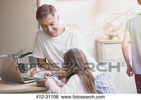Father and daughter enjoying breakfast at laptop View Large Photo Image Stock Photograph - Father and daughter enjoying breakfast at laptop. Fotosearch