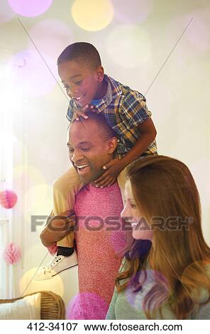 Father carrying son on shoulders View Large Photo Image Stock Photo - Father carrying son on shoulders. Fotosearch