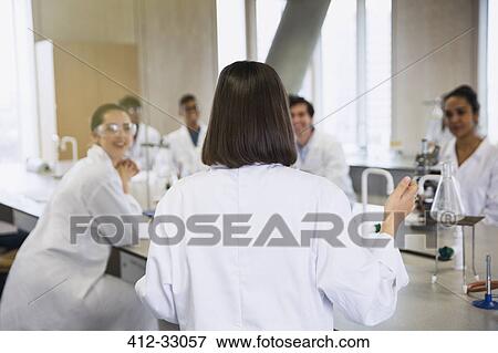 Female college student leading study group in science laboratory classroom View Large Photo Image Stock Photo - Female college student leading study group in science laboratory classroom. Fotosearch