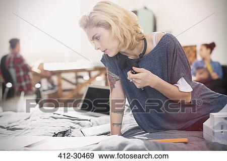 Female college student studying on bed View Large Photo Image Stock Photo - Female college student studying on bed. Fotosearch