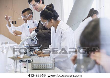 Female college students conducting scientific experiment in science laboratory classroom View Large Photo Image Stock Photo - Female college students conducting scientific experiment in science laboratory classroom. Fotosearch