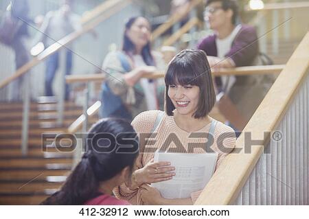 Female college students talking in stairway View Large Photo Image Stock Image - Female college students talking in stairway. Fotosearch