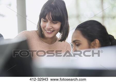 Female college students using computer View Large Photo Image Stock Image - Female college students using computer. Fotosearch