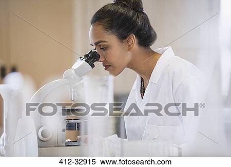 Female scientist using microscope in laboratory View Large Photo Image Stock Photography - Female scientist using microscope in laboratory. Fotosearch