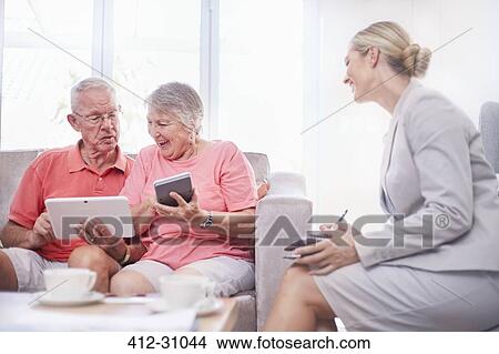 Picture - Financial advisor consulting senior adults. Fotosearch