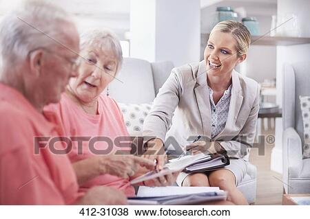 Financial advisor showing digital tablet to senior couple View Large Photo Image Stock Photo - Financial advisor showing digital tablet to senior couple. Fotosearch