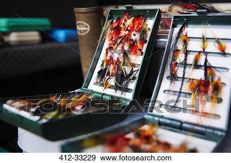 Fly fishing hook reels in tackle boxes View Large Photo Image Stock Photo - Fly fishing hook reels in tackle boxes. Fotosearch