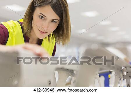 Focused worker examining steel in steel factory View Large Photo Image Stock Photograph - Focused worker examining steel in steel factory. Fotosearch