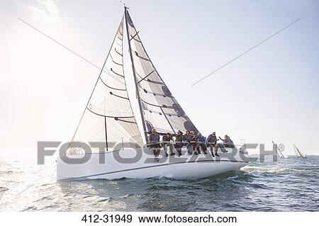 Friends sailing on sunny ocean View Large Photo Image Stock Photo - Friends sailing on sunny ocean. Fotosearch