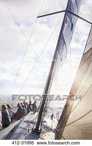 Friends sailing on sunny ocean View Large Photo Image Stock Photography - Friends sailing on sunny ocean. Fotosearch