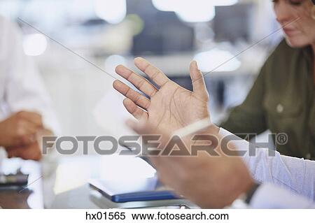 Hands of businessman gesturing in meeting View Large Photo Image Stock Photography - Hands of businessman gesturing in meeting. Fotosearch