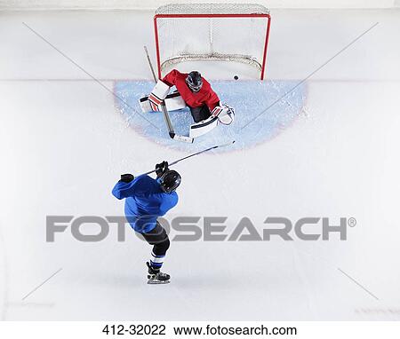 Hockey player scoring a goal View Large Photo Image Stock Image - Hockey player scoring a goal. Fotosearch