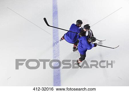 Stock Photograph - Hockey players blocking opponent on ice. Fotosearch
