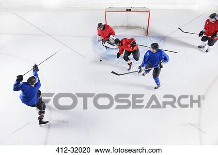 Stock Image - Hockey players on ice. Fotosearch
