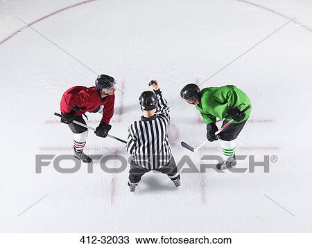 Hockey referee initiating opening face off between opponents View Large Photo Image Stock Image - Hockey referee initiating opening face off between opponents. Fotosearch
