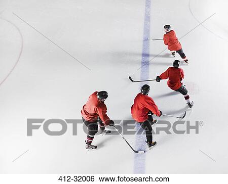 Hockey team in red uniforms skating on ice View Large Photo Image Stock Photograph - Hockey team in red uniforms skating on ice. Fotosearch