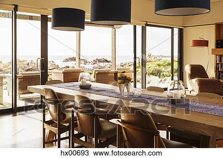 Stock Image - Home showcase dining room with ocean view. Fotosearch