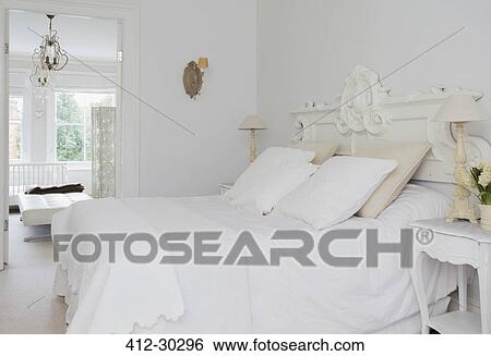 Stock Photograph - Home showcase interior white bed and bedroom. Fotosearch
