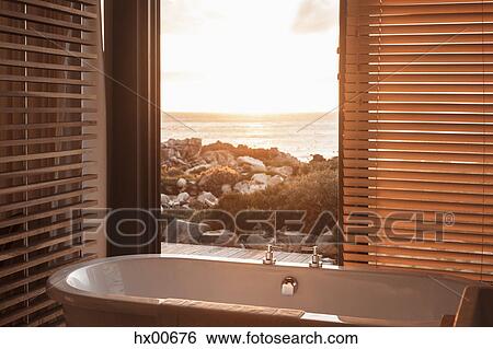 Home showcase soaking tub overlooking ocean View Large Photo Image Stock Photograph - Home showcase soaking tub overlooking ocean. Fotosearch