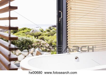 Home showcase soaking tub with view View Large Photo Image Stock Image - Home showcase soaking tub with view. Fotosearch
