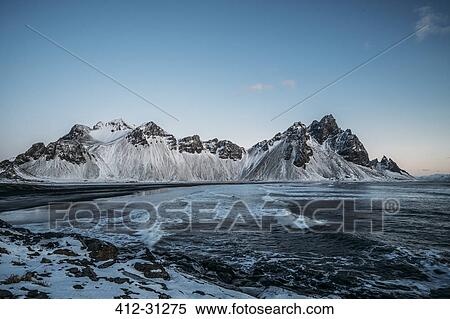 Stock Photography - Icy beach and mountains, Hofn, Iceland. Fotosearch
