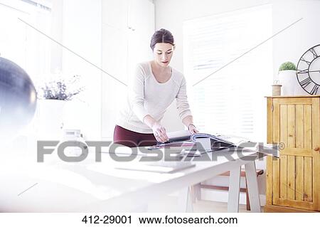 Interior designer browsing fabric swatches in office View Large Photo Image Stock Image - Interior designer browsing fabric swatches in office. Fotosearch