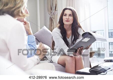 Interior designer showing swatches to couple View Large Photo Image Stock Photograph - Interior designer showing swatches to couple. Fotosearch