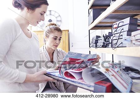 Interior designers browsing fabric swatches in office View Large Photo Image Stock Image - Interior designers browsing fabric swatches in office. Fotosearch