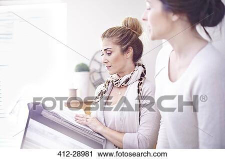 Interior designers browsing fabric swatches in office View Large Photo Image Stock Image - Interior designers browsing fabric swatches in office. Fotosearch