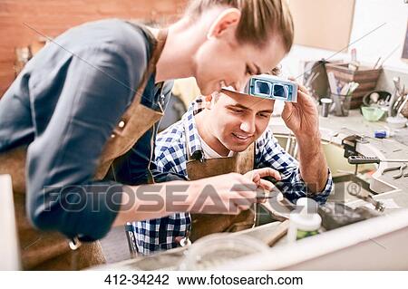 Jewelers working in workshop View Large Photo Image Stock Image - Jewelers working in workshop. Fotosearch