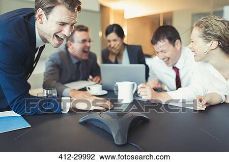 Laughing business people on conference call in conference room View Large Photo Image Stock Image - Laughing business people on conference call in conference room. Fotosearch