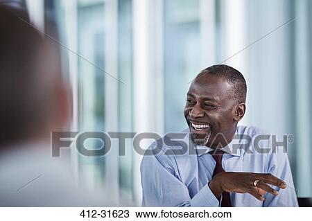 Stock Image - Laughing businessman. Fotosearch