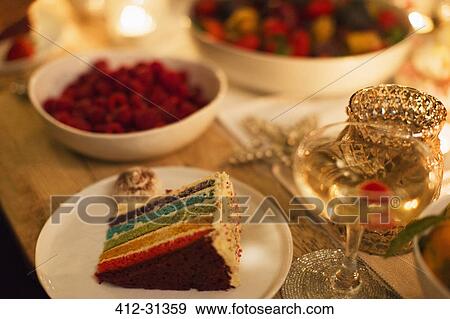 Layer cake and champagne on table View Large Photo Image Stock Photo - Layer cake and champagne on table. Fotosearch
