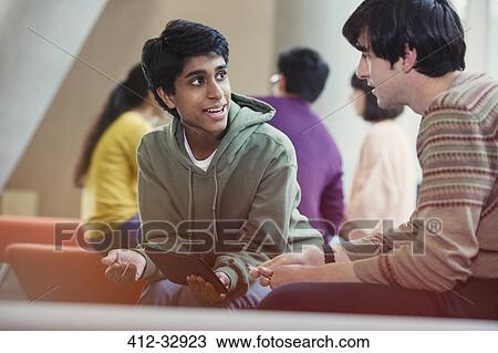 Male college student studying using digital tablet View Large Photo Image Stock Image - Male college student studying using digital tablet. Fotosearch