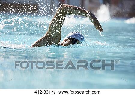 Male swimmer athlete swimming in swimming pool View Large Photo Image Stock Photo - Male swimmer athlete swimming in swimming pool. Fotosearch