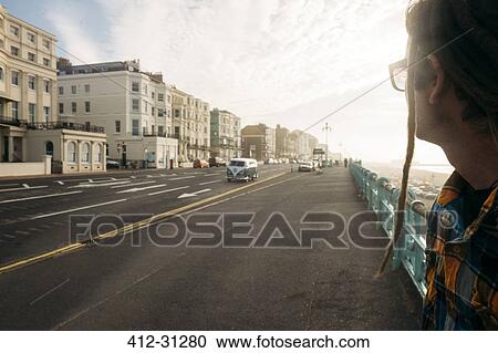 Stock Image - Man waiting to cross street, Brighton, United Kingdom. Fotosearch