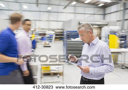 Manager with clipboard in steel industry View Large Photo Image Stock Image - Manager with clipboard in steel industry. Fotosearch