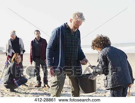 Multi-generation family clamming on sunny beach View Large Photo Image Stock Image - Multi-generation family clamming on sunny beach. Fotosearch