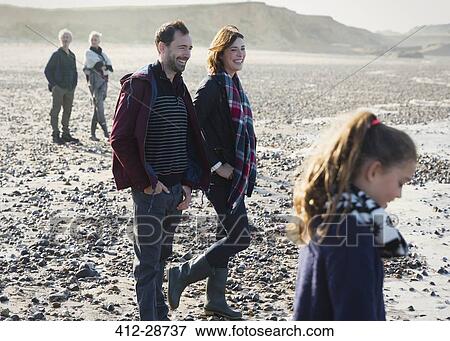 Multi-generation family on sunny beach View Large Photo Image Stock Photo - Multi-generation family on sunny beach. Fotosearch